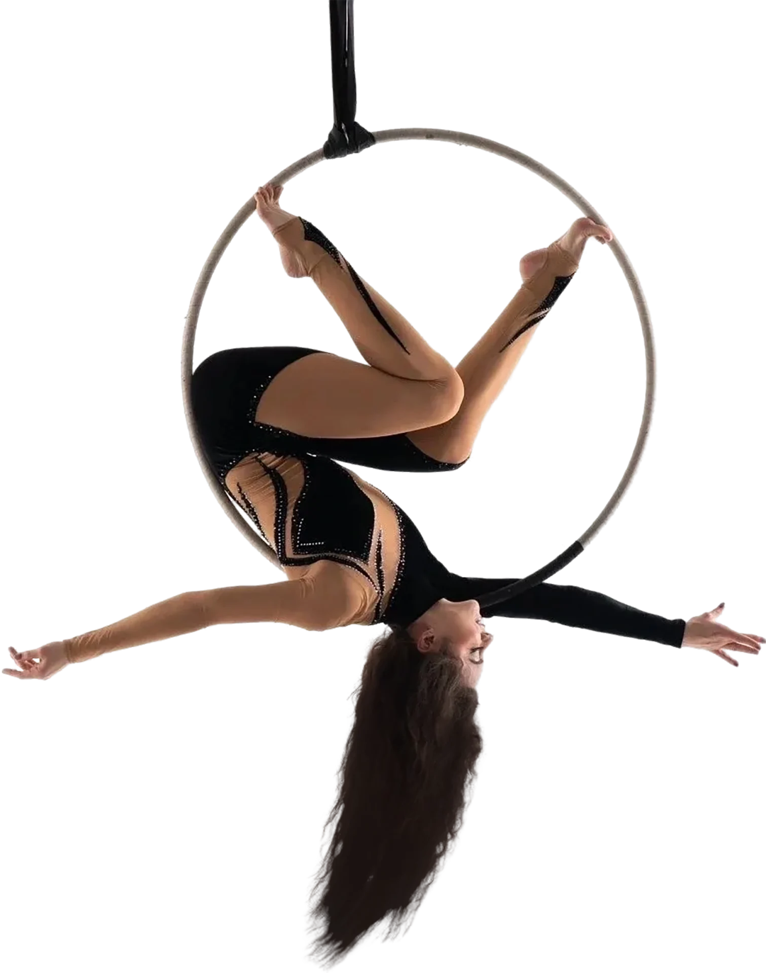 A woman is doing aerial dance on a hoop.